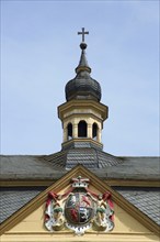 Spire with historical coat of arms on the town hall built in 1770, Kirn, Hunsrück,