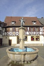 Fountain with sculpture of a boy by Emil Cauer 1938, putto with two bird figures holding hands,