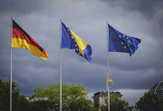 The flags of Germany, Bosnia and Herzegovina and the European Union fly in front of the Reichstag