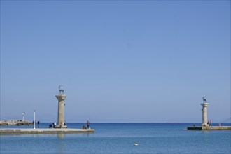 Elafos and Elafina, stag and hind, sculptures on columns, harbour entrance Mandraki harbour,