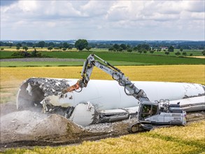 Demolished tower of a 20 year old wind turbine, in the Werl wind farm, 5 old Enercon E-66 turbines