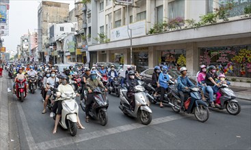 People on Motorcycles in the streets of Saigon, Ho Chi Minh City, Vietnam, Asia