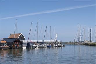 Sailing boats in the harbour of Hindeloopen, province of Friesland, Netherlands