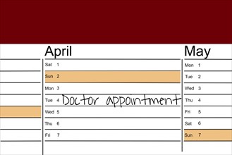 Symbolic image: Appointment diary with note for preventive medical check-up (English)