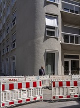 Barrier fences and warning bollards at a construction site in Berlin-Mitte, Germany, Europe