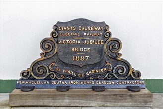 Historic metal plaque with inscription on the 1887 engineering project, Giant Causeway