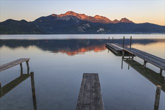 Mountains reflected in lake, footbridge, morning light, summer, silence, Lake Kochel, Alpine