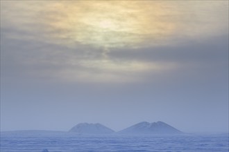 Pingo, mound, permafrost, Arctic, cold, snow, clouds, near Tuktoyaktuk, Northwest Territories,