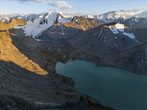 Evening mood, mountain panorama, aerial view, 4000 metre peak with glacier, mountain pass and