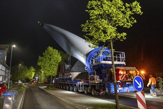 Transport of a 68 metre long, 22 tonne blade of a wind turbine, here in Breckerfeld-Waldbauer, with