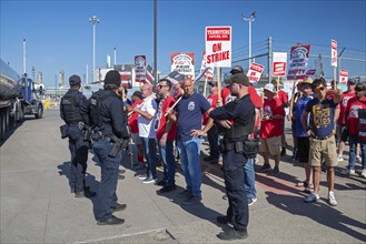 Detroit, Michigan USA, 5 September 2024, Police escort a truck through the picket line as members