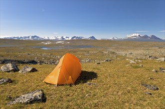 Tent in Stora Sjöfallet National Park, Laponia World Heritage Site, the Acre Massif on the horizon,