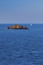 Evening view from the Pointe du Grouin with a view of the Phare de la Pierre-de-Herpin and striking