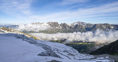 View of mountain peaks and the valley of Chamonix with high fog, Chamonix, Haute-Savoie, France,