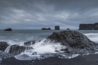 Waves, surf, black beach, lava beach, columnar basalt, rock needles, long exposure, Dyrhólafjara,