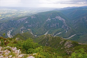 Breathtaking view of a river bend surrounded by a green mountain landscape, River Nestos or Mesta,