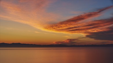 Vast, peaceful sunrise over the sea and colourful clouds, Mani Peninsula, Peloponnese, Greece,