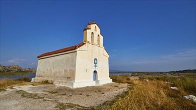 Agiou Petrou Chapel, Chapel of St Peter, Small church stands isolated under a clear blue sky next