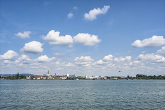 View from the car ferry across Lake Constance to the shore of Lake Constance with the city of