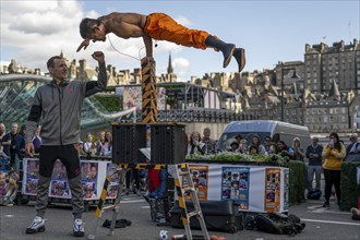 Street performers and spectators, acrobatic performance, Prince Street, world's largest cultural