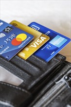 VISA, Mastercard and American Express credit cards in your wallet in Stuttgart, Germany, Europe