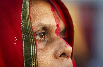 Hindu devotees perform rituals as they offer prayers to the Sun god in the bank of Brahmaputra