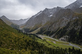 Green mountain valley with river and steep mountain peaks, Chong Kyzyl Suu Valley, Terskey Ala Too,