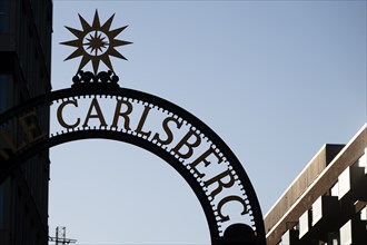 Archway with Carlsberg lettering and sun symbol, Carlsberg district, Copenhagen, Denmark, Europe