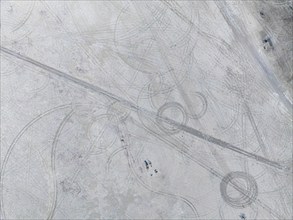 Tyre tracks in the salt pan, top-down, aerial view, Kubu Island, Botswana, Africa