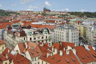 Aerial view over the red roofs of Prague, the Castle and the Cathedral, Prague, Bohemia, Czech