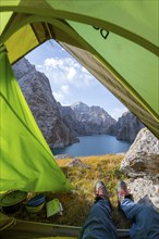 Wild camping, camping in the wilderness with a tent, Kol Suu mountain lake, Sary Beles Mountains,