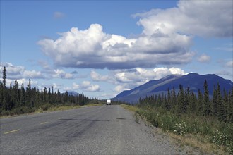 Endless road with single motorhome, adventure, forest, wilderness, Alaska Highway, Yukon Territory,