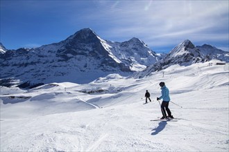 Skiing against the backdrop of the north face of the Eiger in Grindelwald, Switzerland, Europe