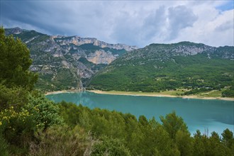 Mountain landscape with the Lac de Sainte-Croix reservoir and tree-covered slopes, summer, Lac de