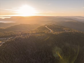 Sunrise over wooded hills in a quiet atmosphere and golden hour, Black Forest, Germany, Europe