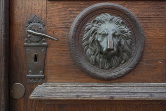 Sculpture of a lion's head on an old entrance door, Passau, Lower Bavaria, Bavaria, Germany, Europe