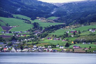 Mountains and Fiord over Norwegian Village in Olden, Innvikfjorden, Norway, Europe