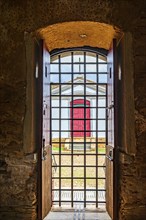 Small church seen from inside an old prison in the historic city of Mariana in the state of Minas