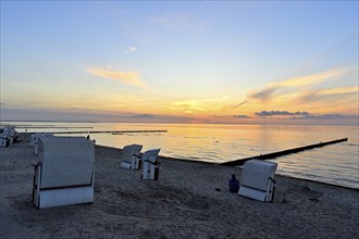 Beach chairs on the beach of the island of Poel at sunset, Mecklenburg-Vorpommern, Germany, Europe