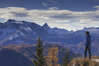 Walker looking over mountains from Mount Jenner in the Berchtesgaden National Park in autumn,