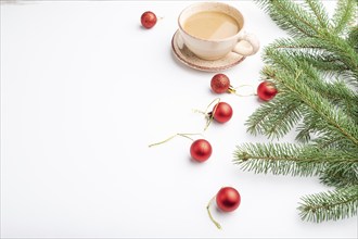 Christmas or New Year composition. Decorations, red balls, fir and spruce branches, cup of coffee,