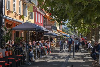 Meersburg on Lake Constance, lakeside promenade, many people, restaurant, house facades,