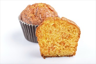 One and a half carrot muffin isolated on white background. closeup