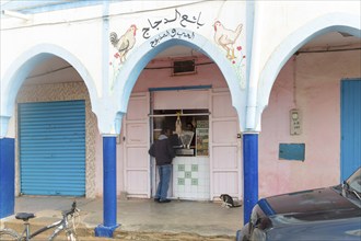 Shop selling poultry historic arcaded shopping street in town centre, Mirleft, southern Morocco,