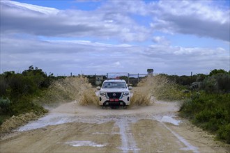 Jepp drives through water, De Hoop Nature Reserve, nature reserve near Struisbaai, Garden Route,