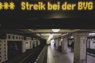 The announcement of a BVG strike is displayed on a display board at Rüdesheimer Platz underground