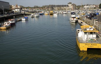 Boats at moorings in the harbour, Weymouth, Dorset, England, United Kingdom, Europe