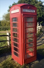 Traditional red telephone box in the countryside, Sussex, England, United Kingdom, Europe