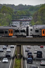 Rhine-Ruhr-Express, RRX train crossing the A3 motorway, traffic on 8 lanes, including the