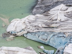 Rhone glacier covered with sheets to protect the ice from melting above the glacier cave,